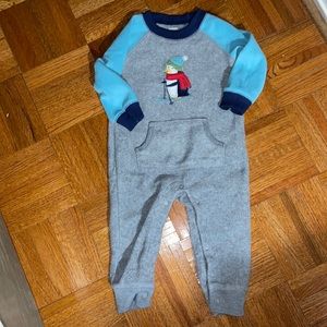 Carter’s fleece snap one piece with front pocket skiing penguin appliqué. 12m